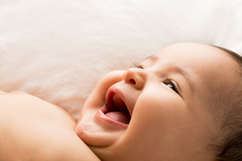 baby laughing at 1 month